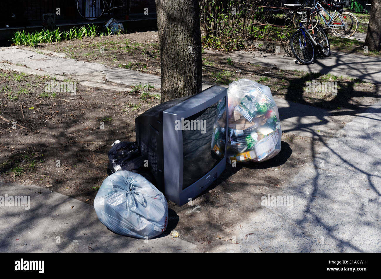 A TV thrown out with the garbage Stock Photo
