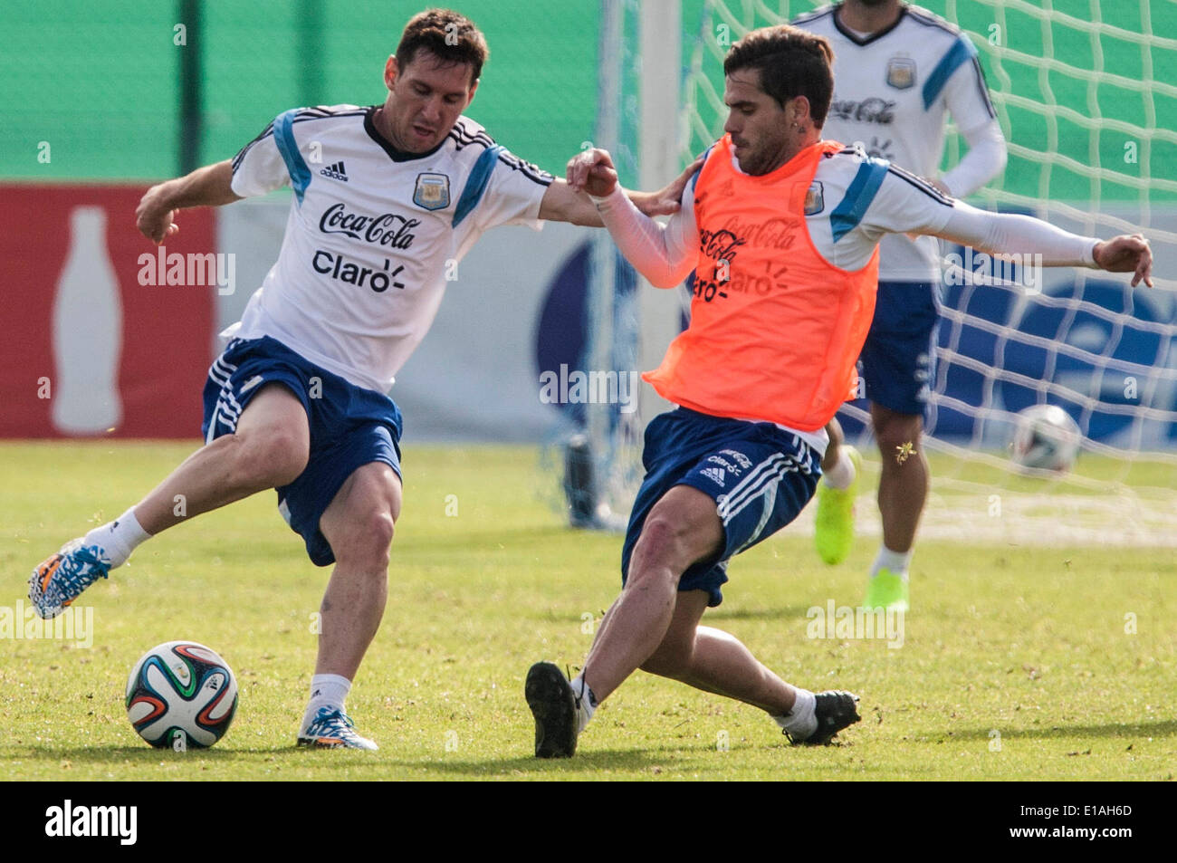 Ezeiza. 28th May, 2014. Argentina's national soccer team players Lionel Messi (L) and Fernando Gago take part in a training session in Ezeiza City May 28, 2014. Argentina will face Trinidad and Tobago and Slovenia in friendly matches prior to the FIFA World Cup Brazil 2014, to be held from June 12 to July 13. © Martin Zabala/Xinhua/Alamy Live News Stock Photo