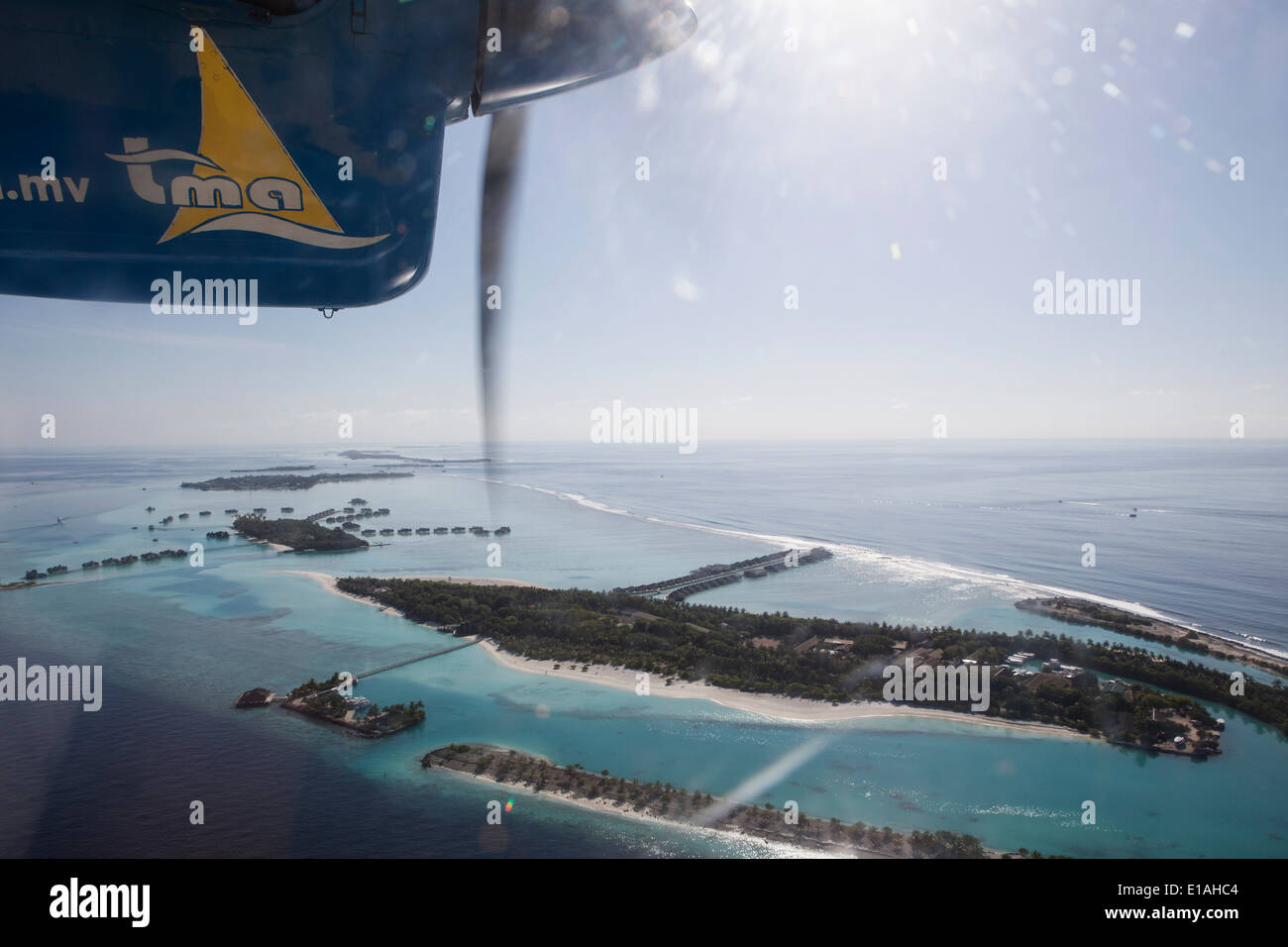 Propeller plane (water taxi) flying between islands in the Maldives