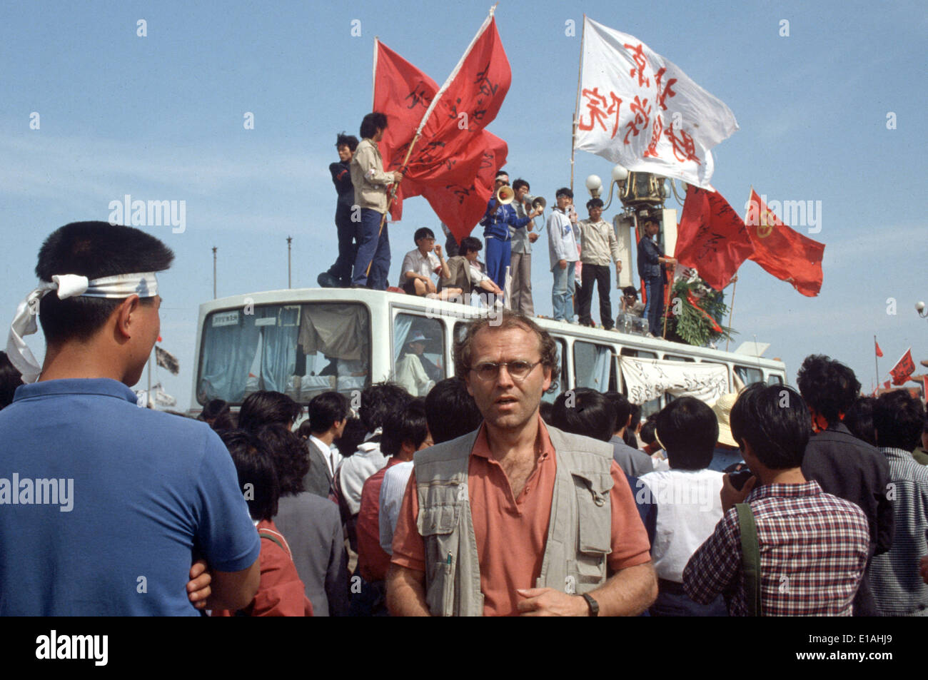 (FILE) - An archive picture, dated 19 May 1989, shows dpa correspondent Edgar Bauer standing amongst a crowd of protesting students on Tiananmen Square in Bejing, China. 25 Years ago, the protests widened in Chinas captial but were eventually violently beaten down. Photo: Edgar Bauer/dpa Stock Photo