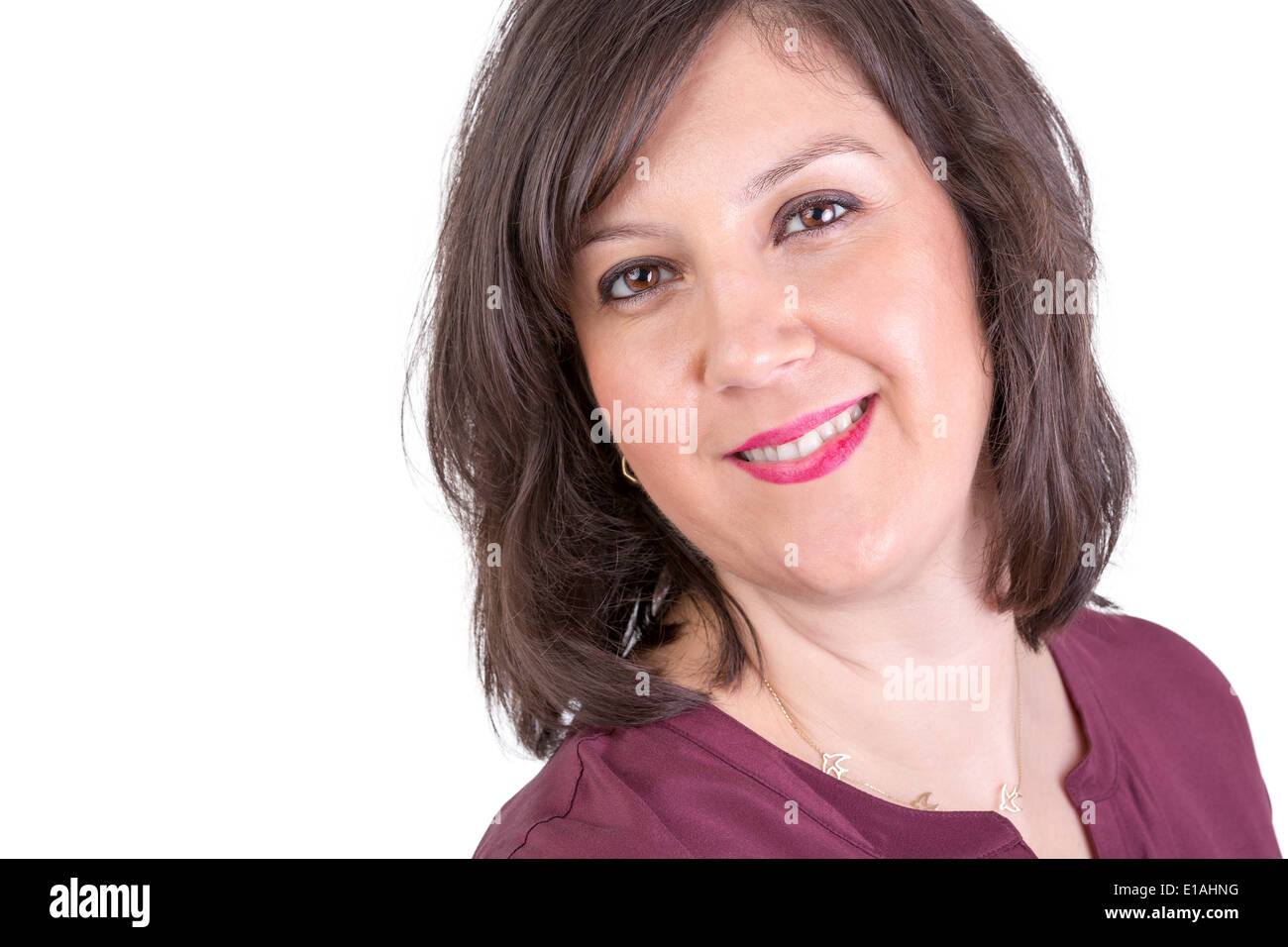 Dark Hair middle age woman looking in to your eyes naturally happy Stock Photo