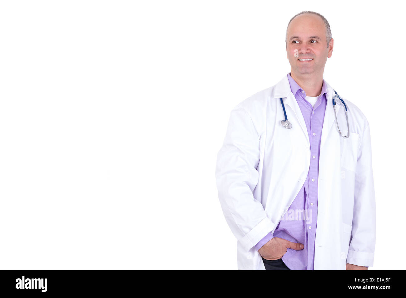 Middle age male practitioner doctor looking out anticipatory with a confident smile and relaxed Stock Photo