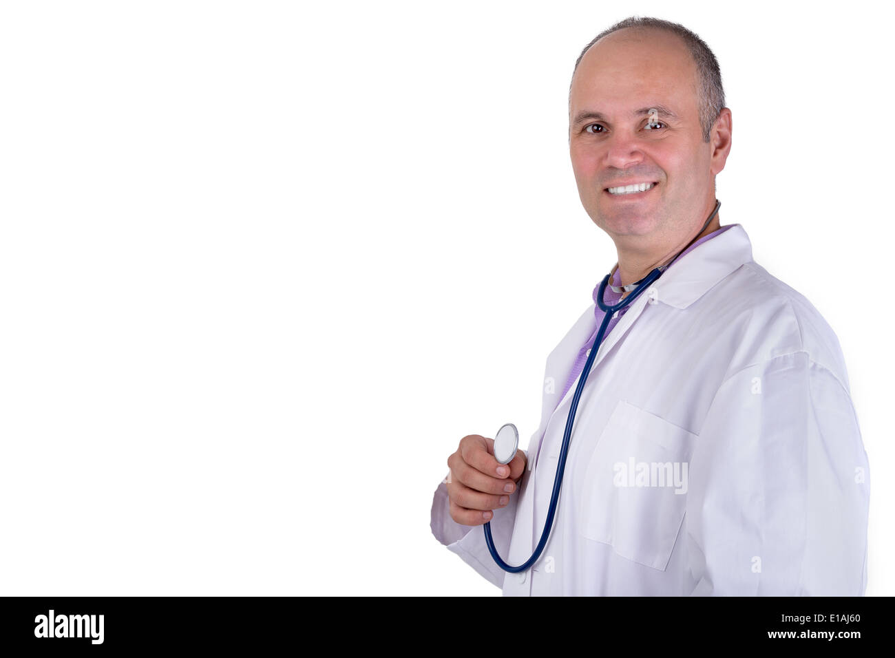 Middle age male practitioner doctor looking at you trustfully with a confident smile and holding his stethoscope Stock Photo