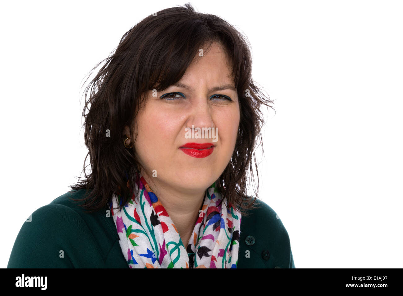 Young woman looking at you irritated and disgust with squinting eyes Stock Photo