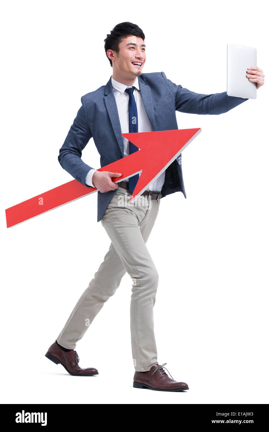 Fashionable businessman with red arrow sign Stock Photo - Alamy