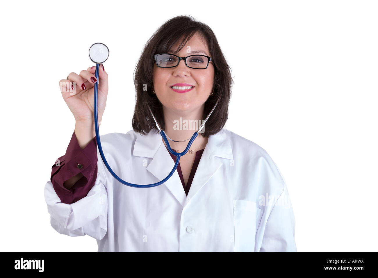 Sympathetic healthcare Intern looking at you genuinely and friendly while holding her stethoscope high Stock Photo