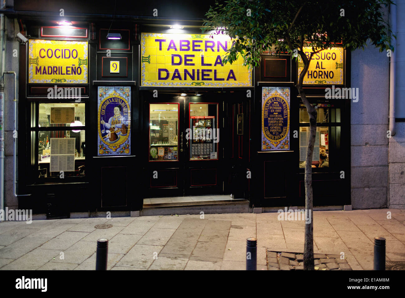 Entrance View of a Tapas Bar at Night Taverna De La Daniela, Madrid, Spain Stock Photo
