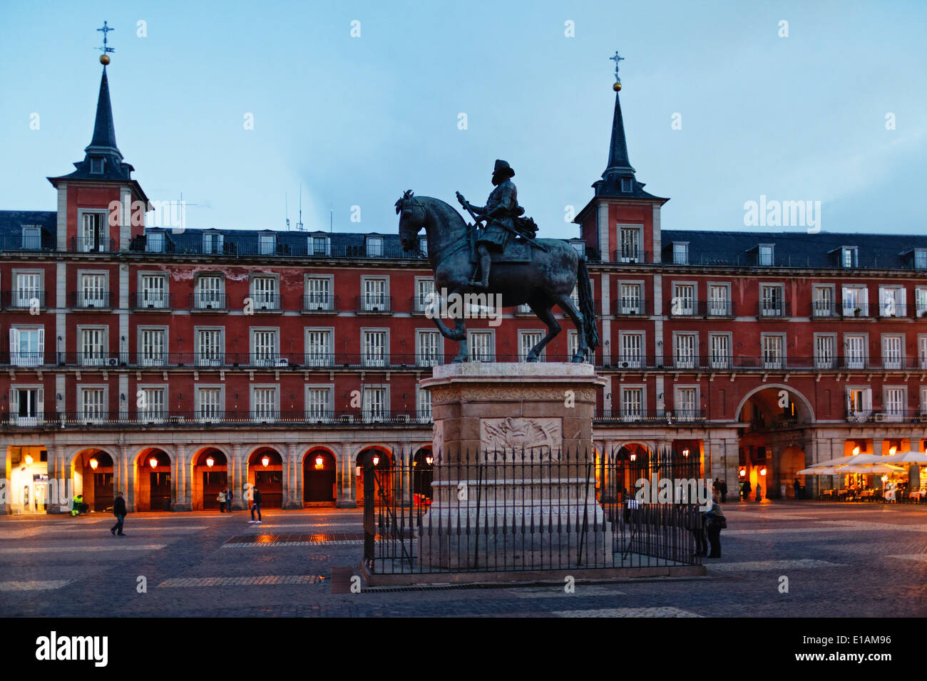 View of the Equestrian Statue of King Philip III on Plaza Mayor at Night, Madrid, Spain. Stock Photo