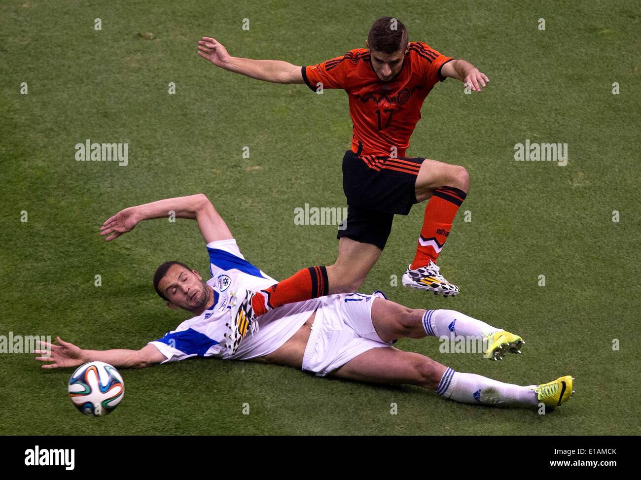 Mexico City, Mexico. 28th May, 2014. Isaac Brizuela (R) from Mexico vies for the ball with Ben Sahar from Israel during a friendly match at the Azteca Stadium in Mexico City, capital of Mexico, on May 28, 2014. Credit:  David de la Paz/Xinhua/Alamy Live News Stock Photo