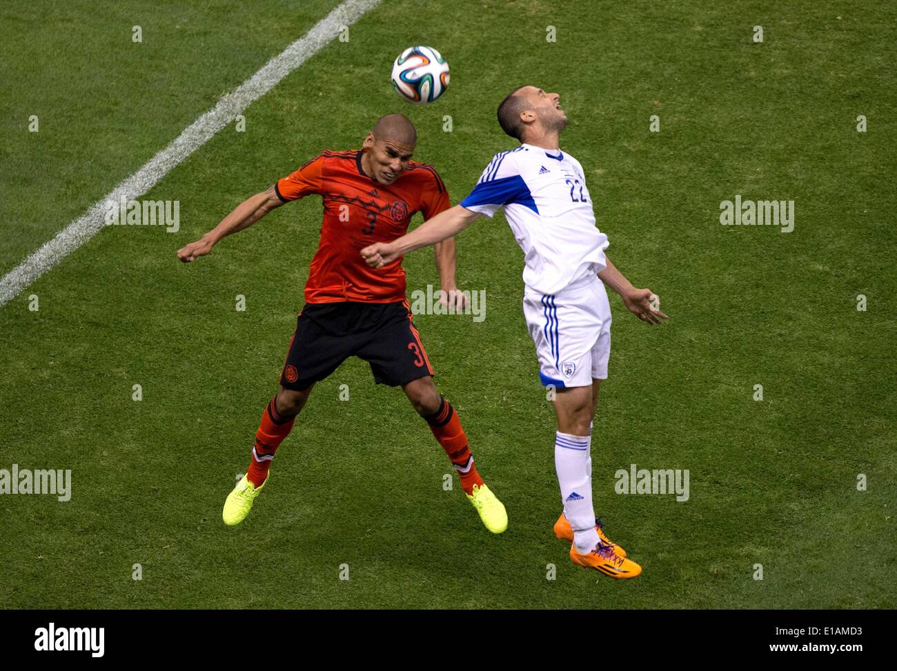 Mexico City, Mexico. 28th May, 2014. Carlos Salcido (L) from Mexico vies for the ball with Omer Damari from Israel during a friendly match at the Azteca Stadium in Mexico City, capital of Mexico, on May 28, 2014. Credit:  David de la Paz/Xinhua/Alamy Live News Stock Photo