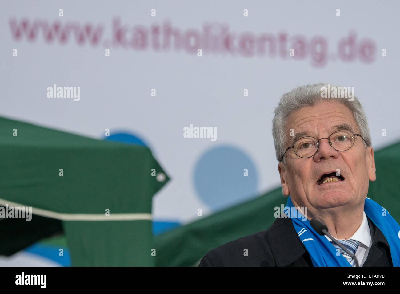Regensburg, Germany. 28th May, 2014. President of Germany, Joachim Gauck, speaks during the opening ceremony of the 99th German Catholics Day in Regensburg, Germany, 28 May 2014. Ten-thousands of believers are expected in Regensburg for the five day event. Photo: ARMIN WEIGEL/dpa/Alamy Live News Stock Photo