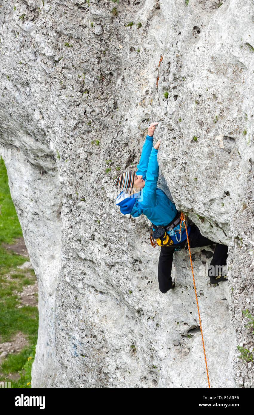 Female climber, woman climbing rock. Stock Photo