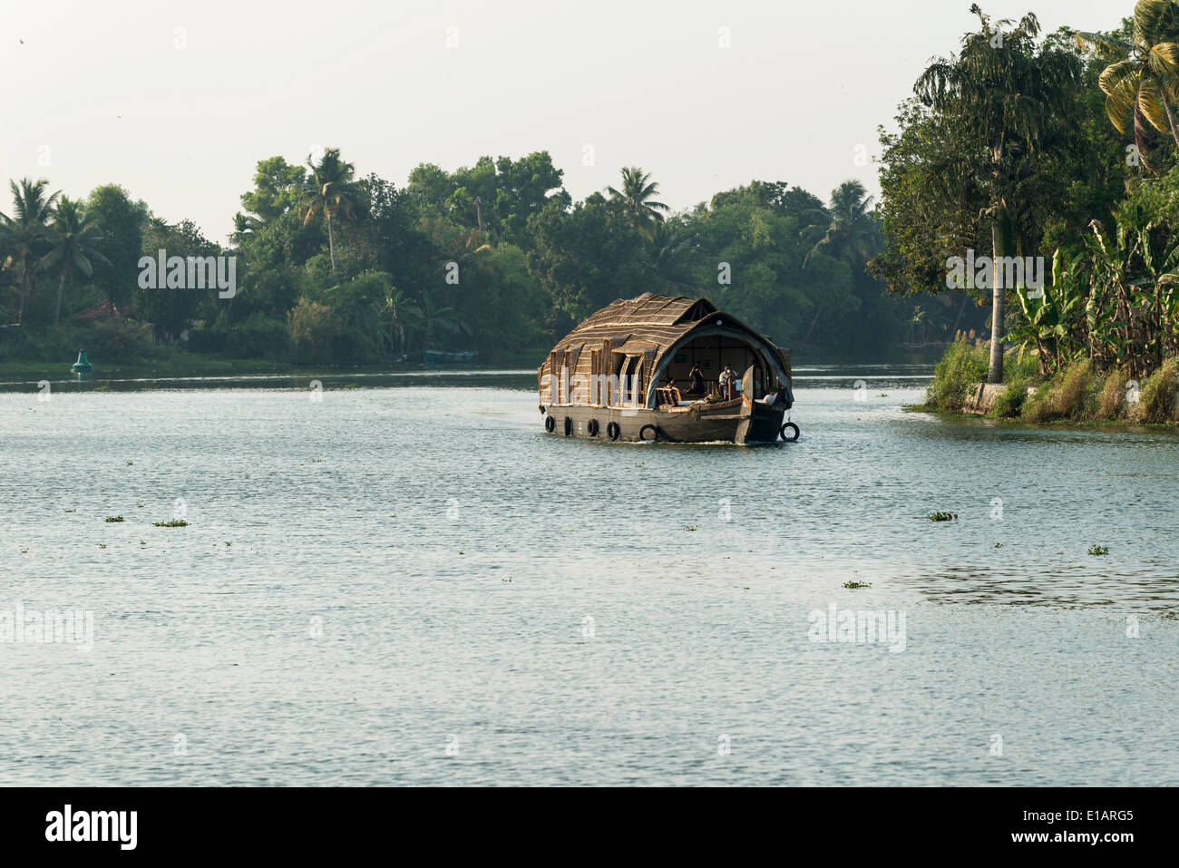 Typical houseboat on a canal, Kerala backwaters at dusk, Alappuzha, Kerala, India Stock Photo