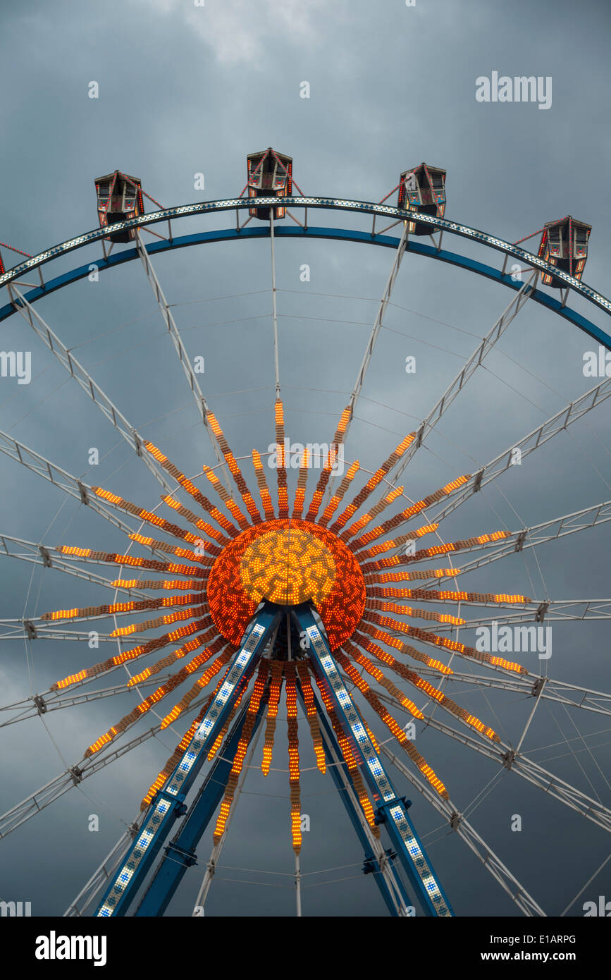 Ferris wheel against dark clouds, Munich Spring Festival, Theresienwiese, Munich, Bavaria, Germany Stock Photo