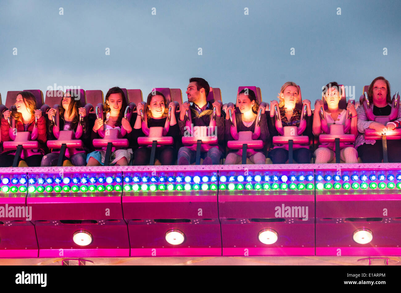 People sitting in a ride, Munich Spring Festival, Theresienwiese, Munich, Bavaria, Germany Stock Photo