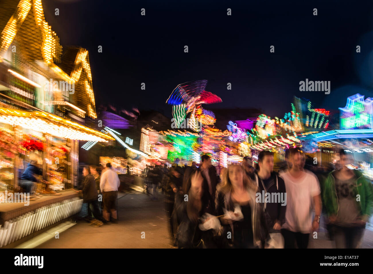Festival visitors and rides at night, Munich Spring Festival
