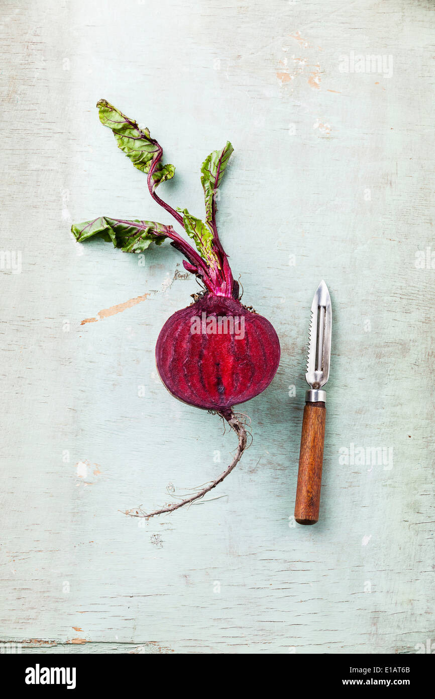 Ripe beetroot with leaves on textured background Stock Photo