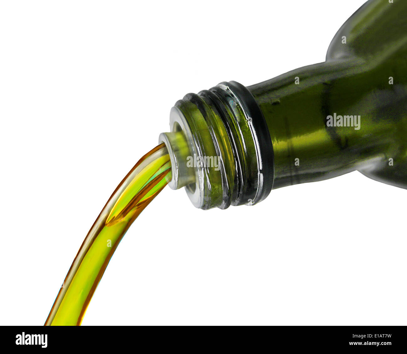 Olive oil pouring from a bottle Stock Photo