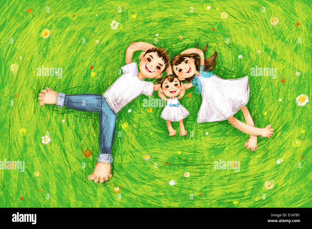 Happy family lying on grass Stock Photo - Alamy