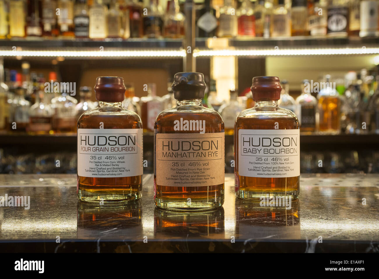 three bottles of Hudson Bourbon on a bar Stock Photo