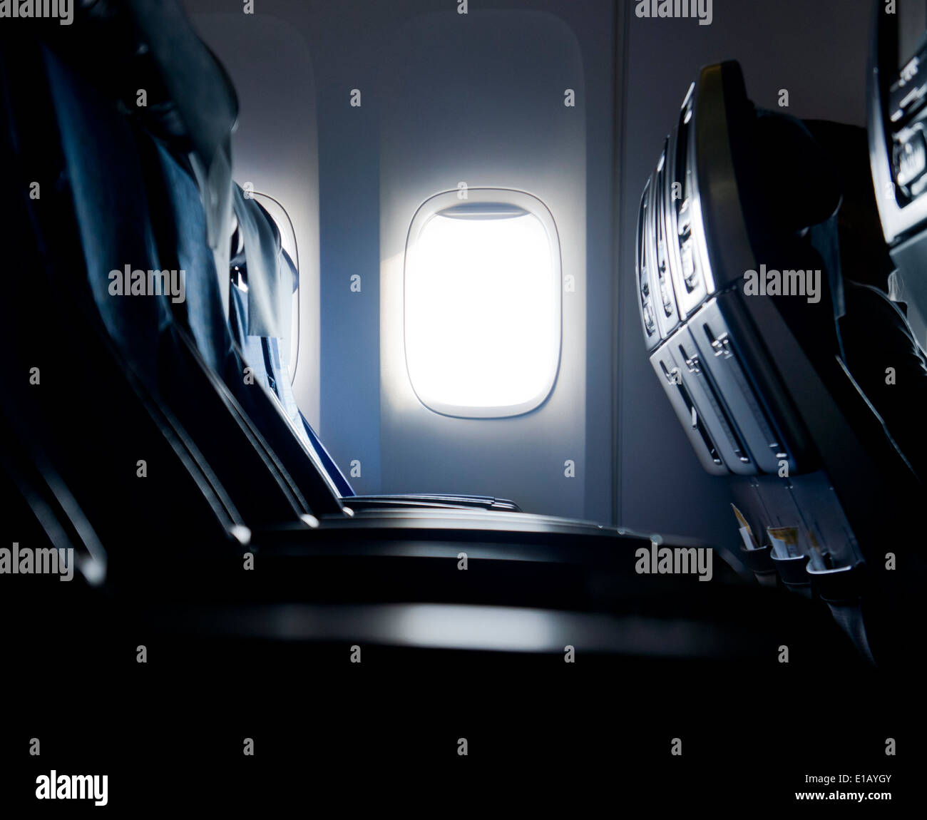 Empty aircraft seats and windows. Stock Photo