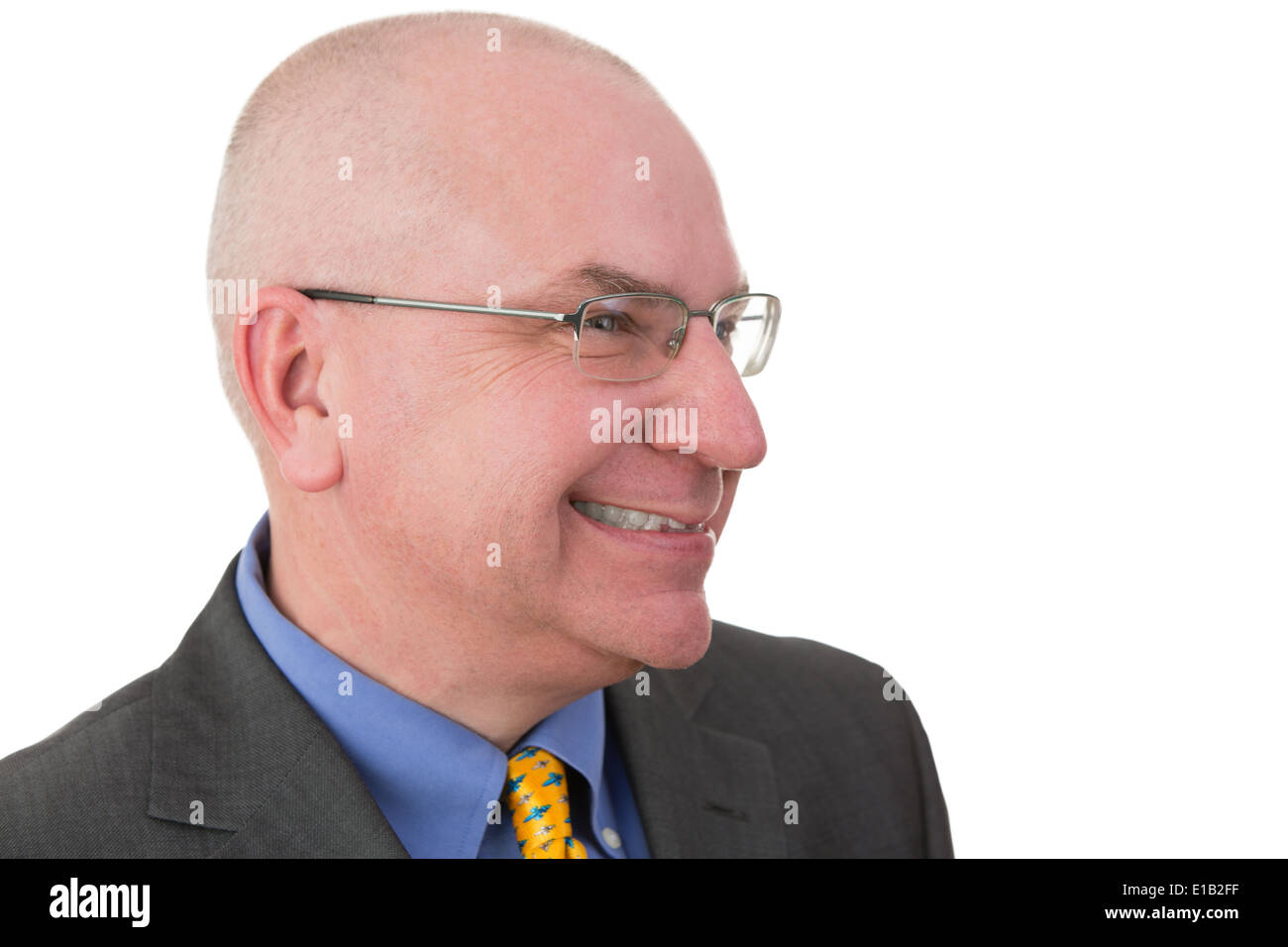 Middle-aged businessman giving a wry smile as he realises the irony of a situation, head and shoulders portrait on white with hi Stock Photo