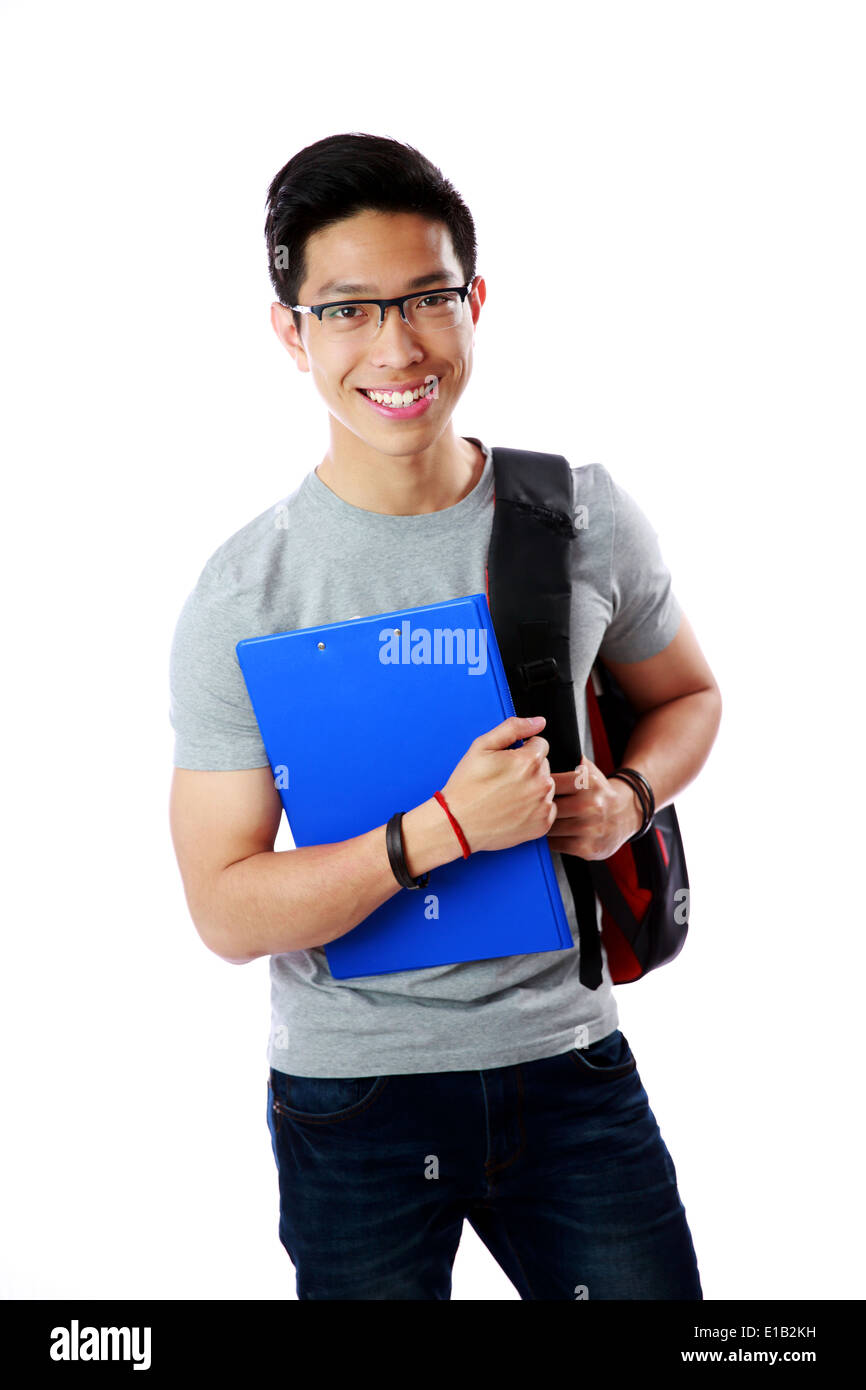 Young student with backpack and notebook standing over white background Stock Photo