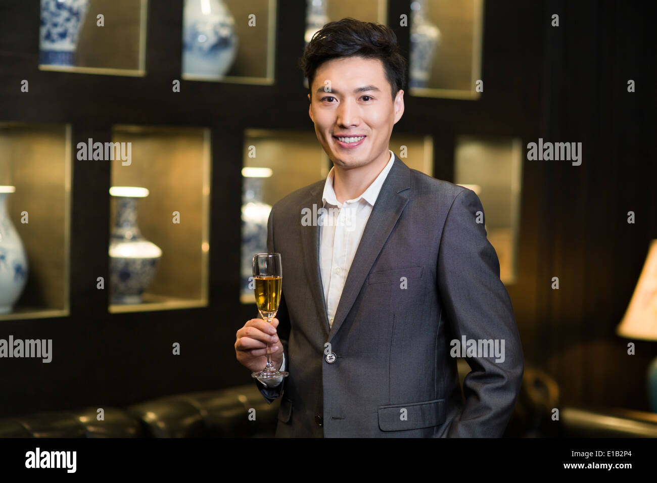 Young businessman with champagne Stock Photo