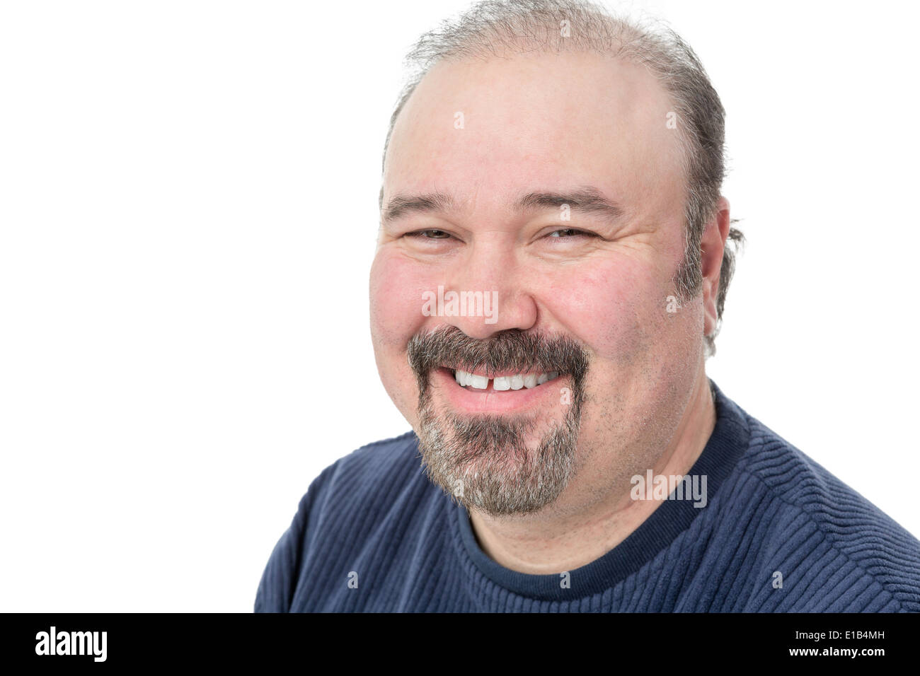 Closeup portrait of a middle-aged man with a goatee enjoying a good laugh smiling happily at the camera isolated on white with c Stock Photo