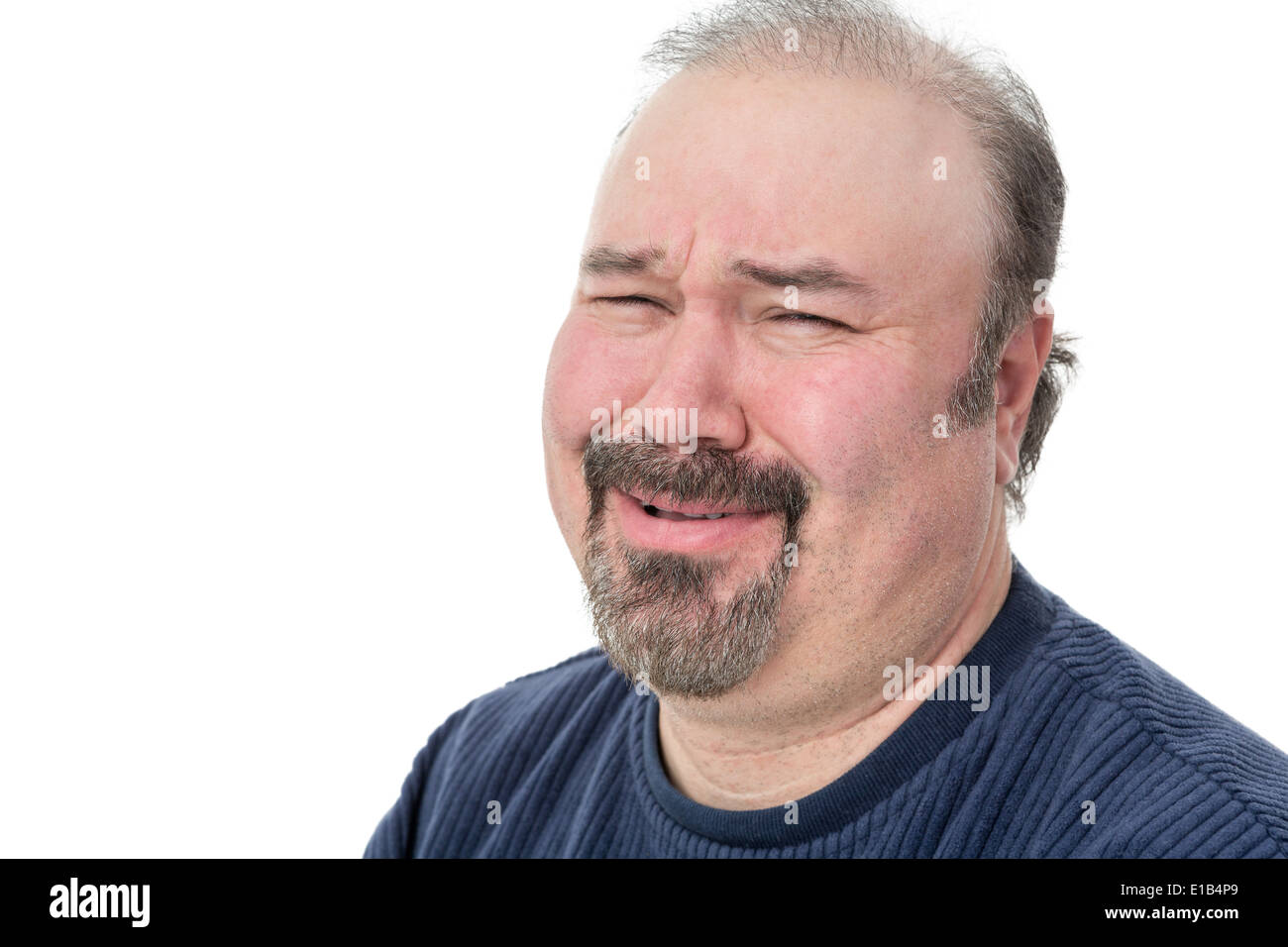 Close-up portrait of a man laughing with a disbelief expression Stock Photo