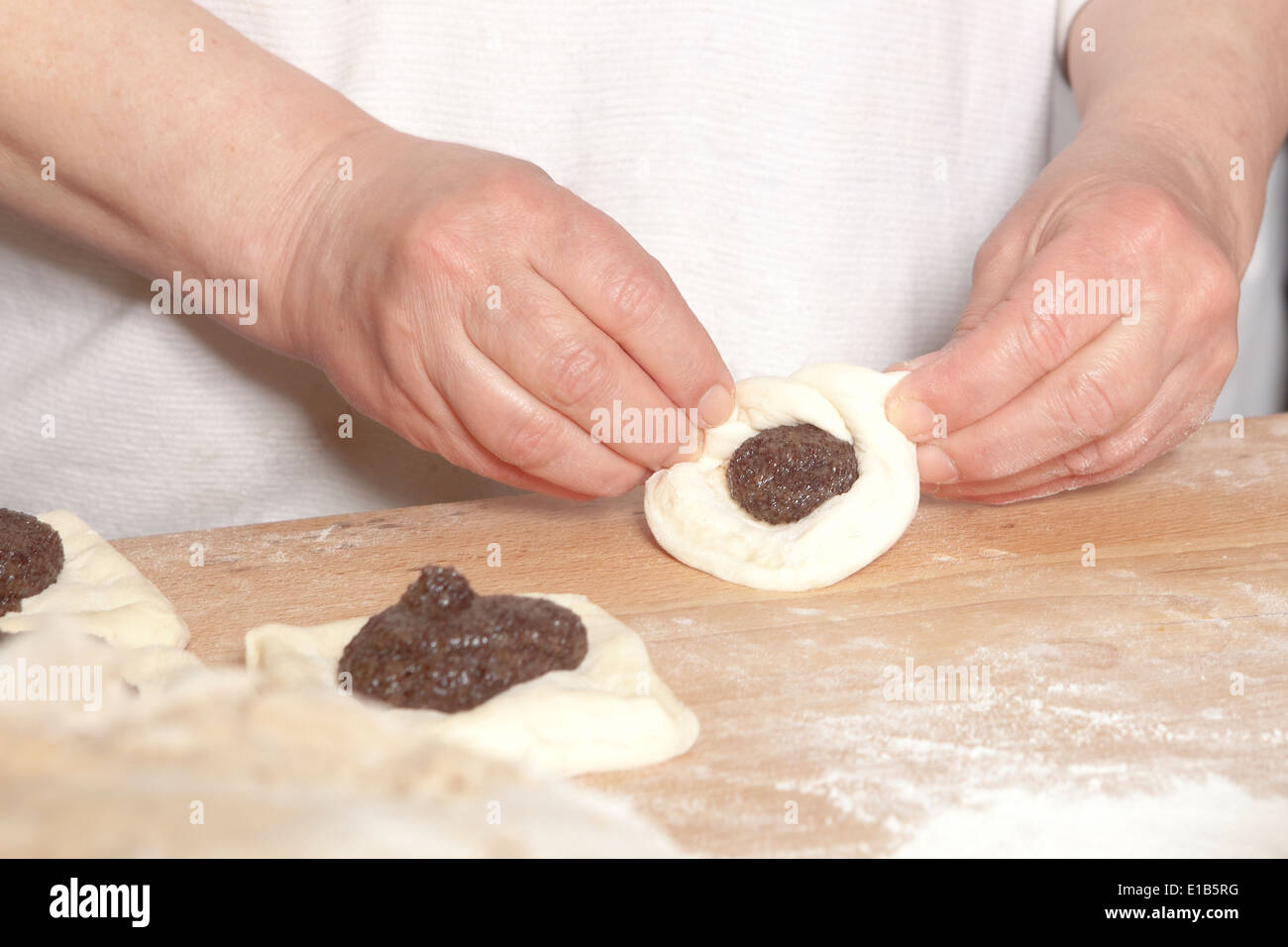 Professional Bakery - Baker Making Sweet Pastry Stock Photo
