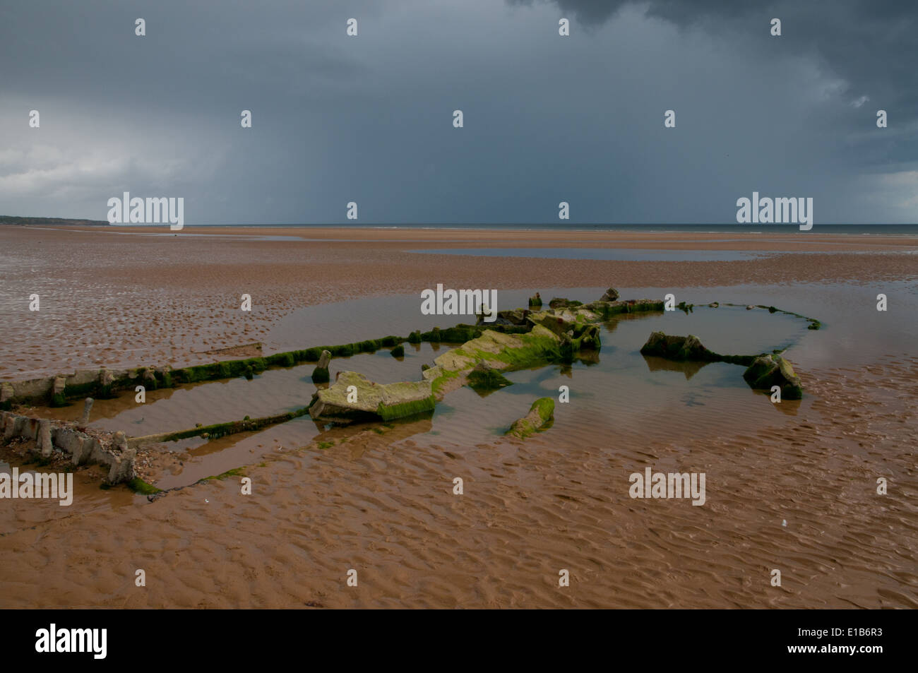 Boat wreckage, remains of Normandy invasion, on Omaha Beach, France Stock Photo