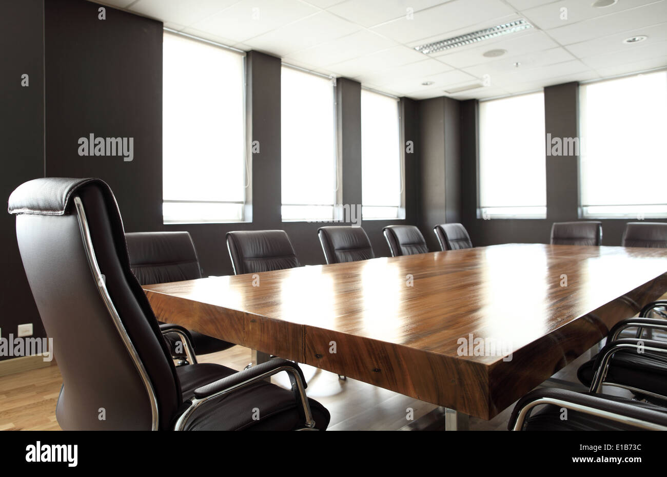 Modern meeting room with solid wood table Stock Photo