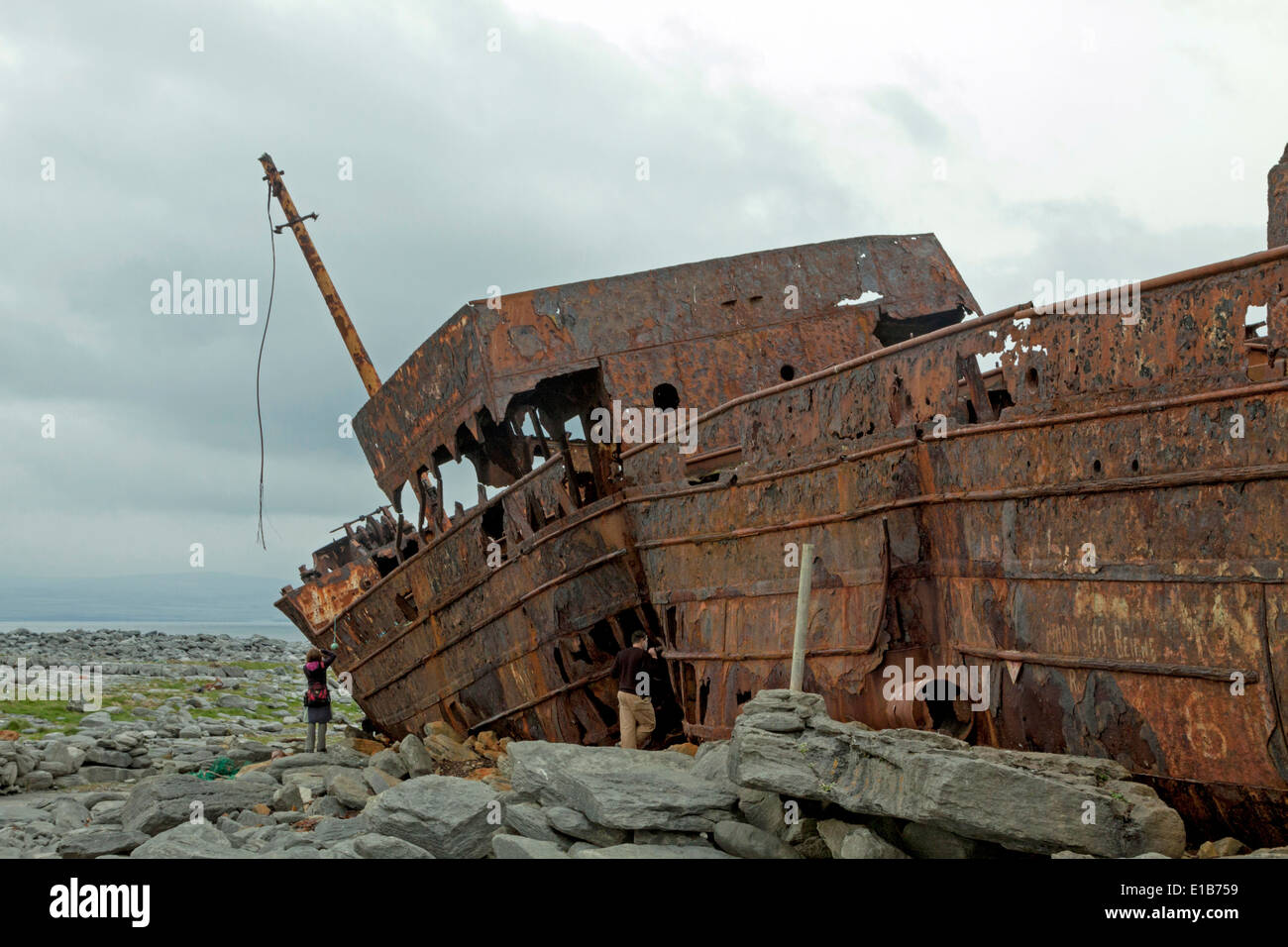 The rusty shipwreck of MV Plassey on Finnis Rock, Inis Oirr or Inisheer, one of the three Aran Islands, Republic of Ireland. Stock Photo