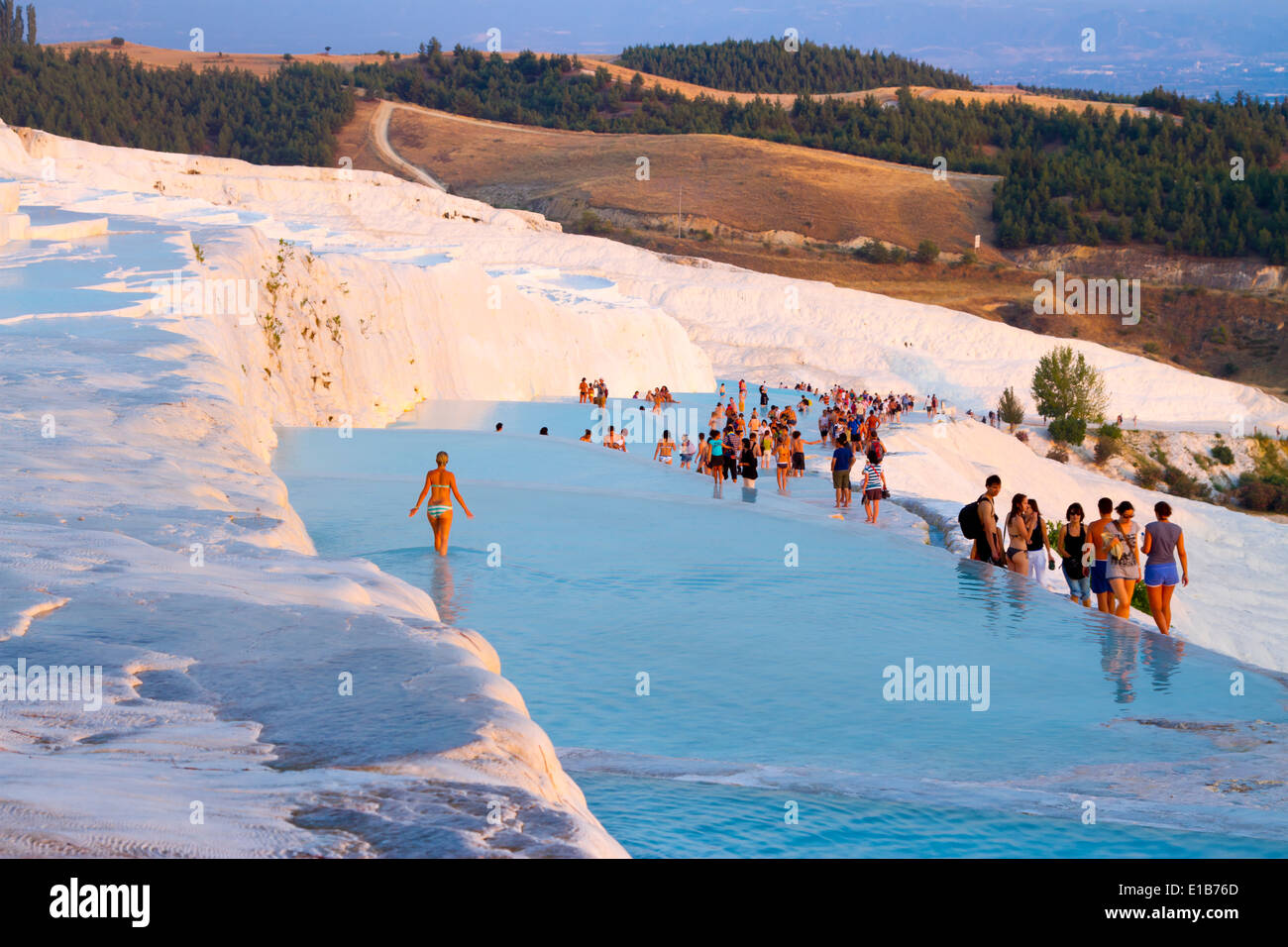 Travertine terrace formations and tourists. Pamukkale. Denizli province. Anatolia, Turkey. Stock Photo