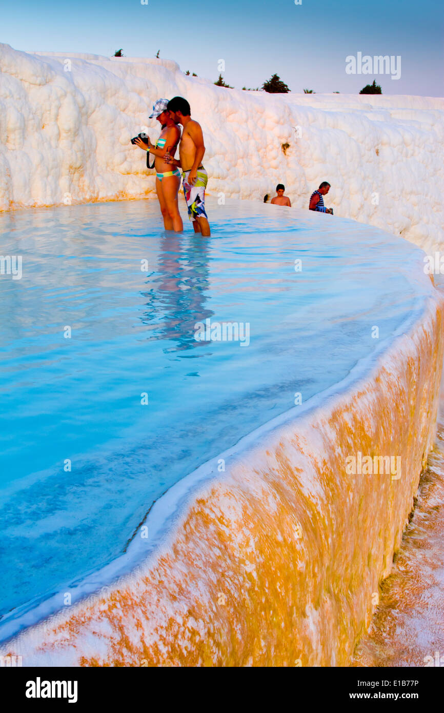 Travertine terrace formations and tourists. Pamukkale. Denizli province. Anatolia, Turkey. Stock Photo