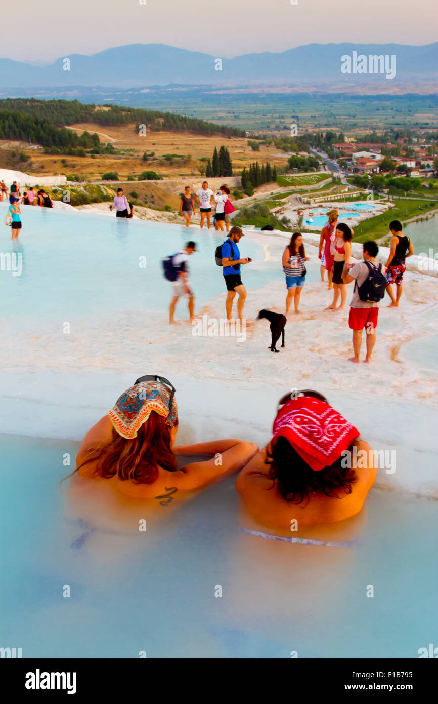 Travertine terrace formations and tourists. Pamukkale. Denizli province. Anatolia, Turkey. Stock Photo