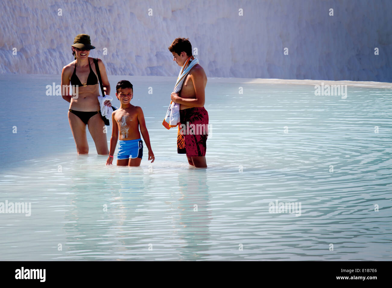 Travertine terrace formations and tourists. Pamukkale. Denizli province. Anatolia, Turkey. Stock Photo
