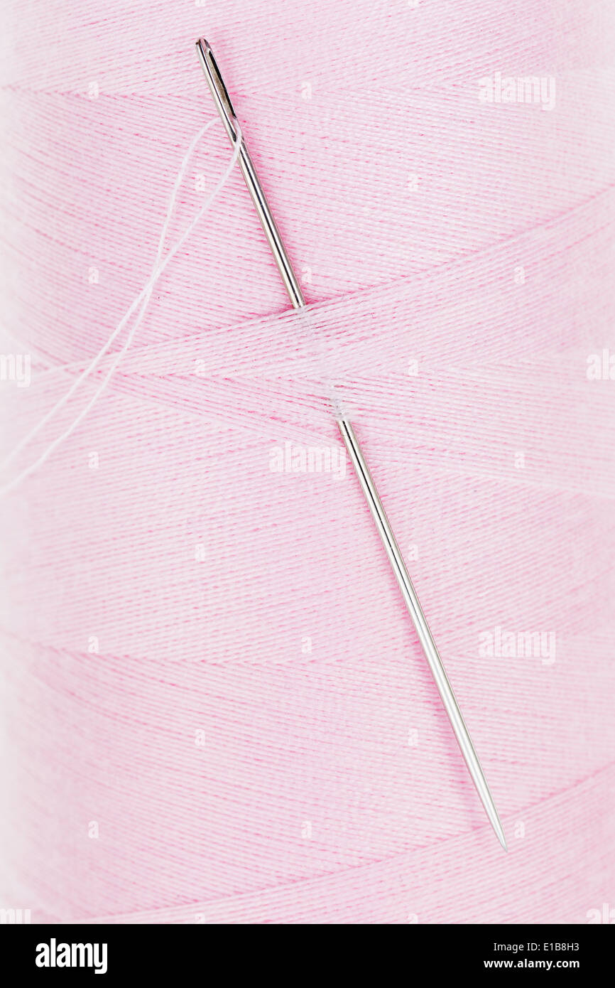 Premium Photo  Spool of thread and needles for sewing closeup