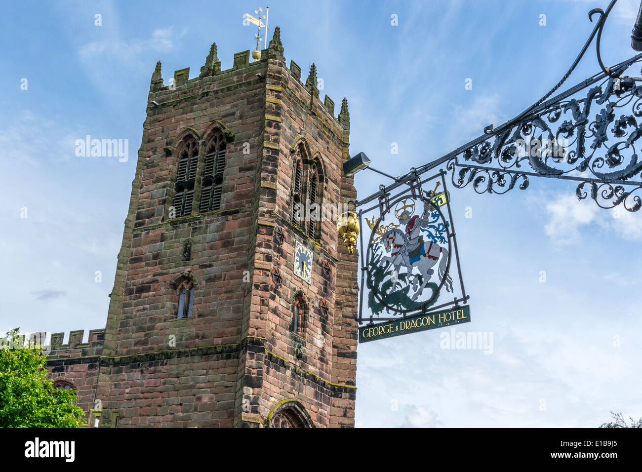 View of village church at Great Budworth, Cheshire. Photo taken from outside the George and Dragon pub. Stock Photo
