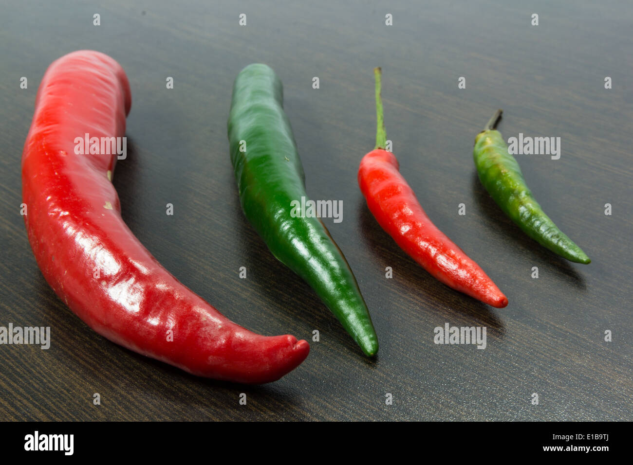 Red and green chili on wood Stock Photo - Alamy