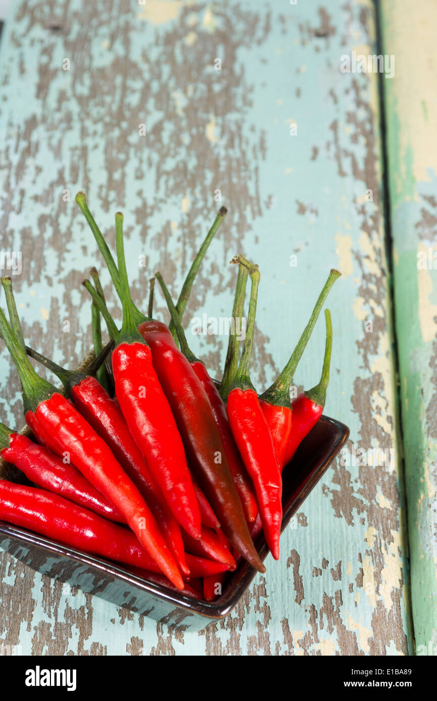 Red and green chili on wood Stock Photo