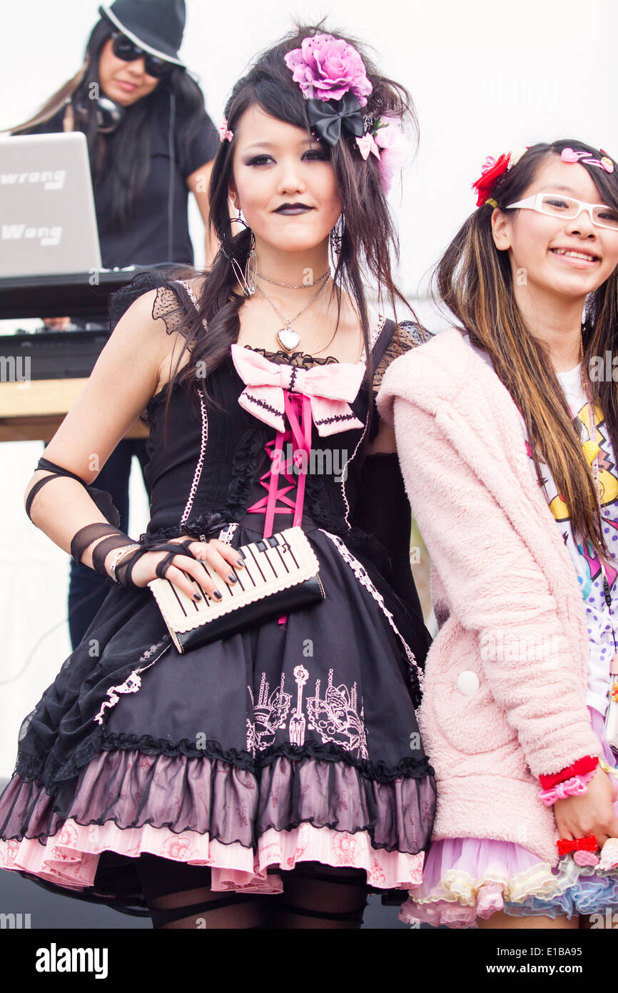 Gothic Lolita dressed in black and pink Stock Photo