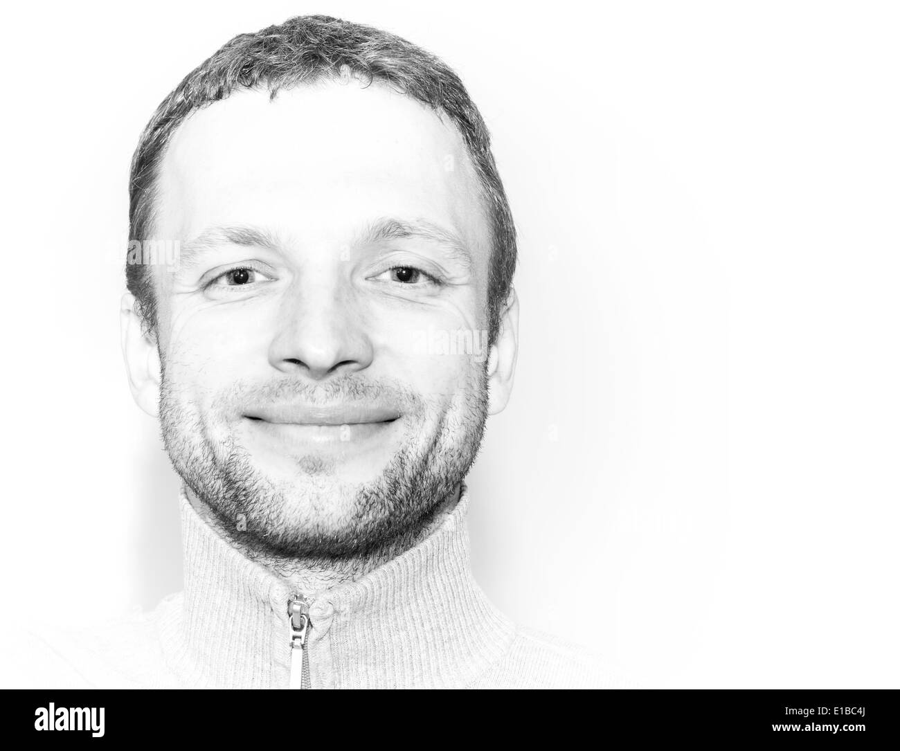 Smiling young Caucasian Man, closeup black and white portrait Stock Photo