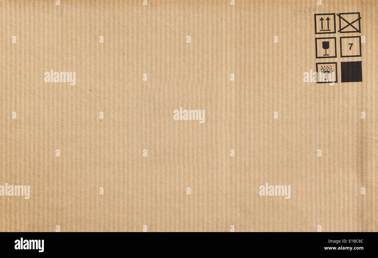 Brown cardboard with standard cargo signs, background texture Stock Photo
