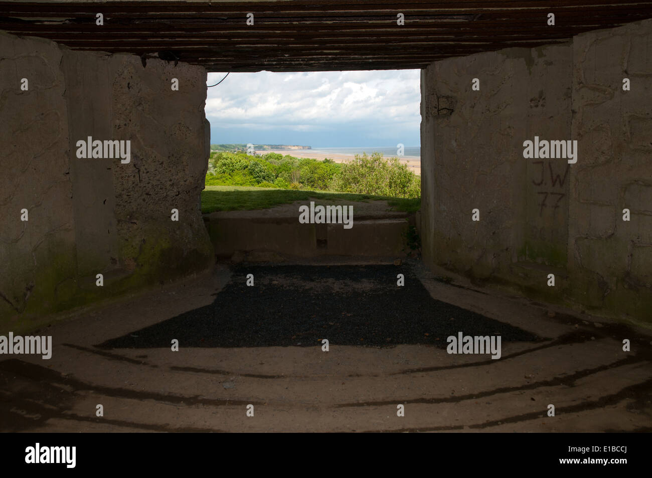View of Omaha Beach from inside German bunker overlooking beach from bluff, Normandy, France Stock Photo