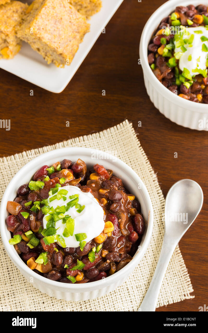 Vegetarian chili with onions, tomatoes, corn, kidney and black beans
