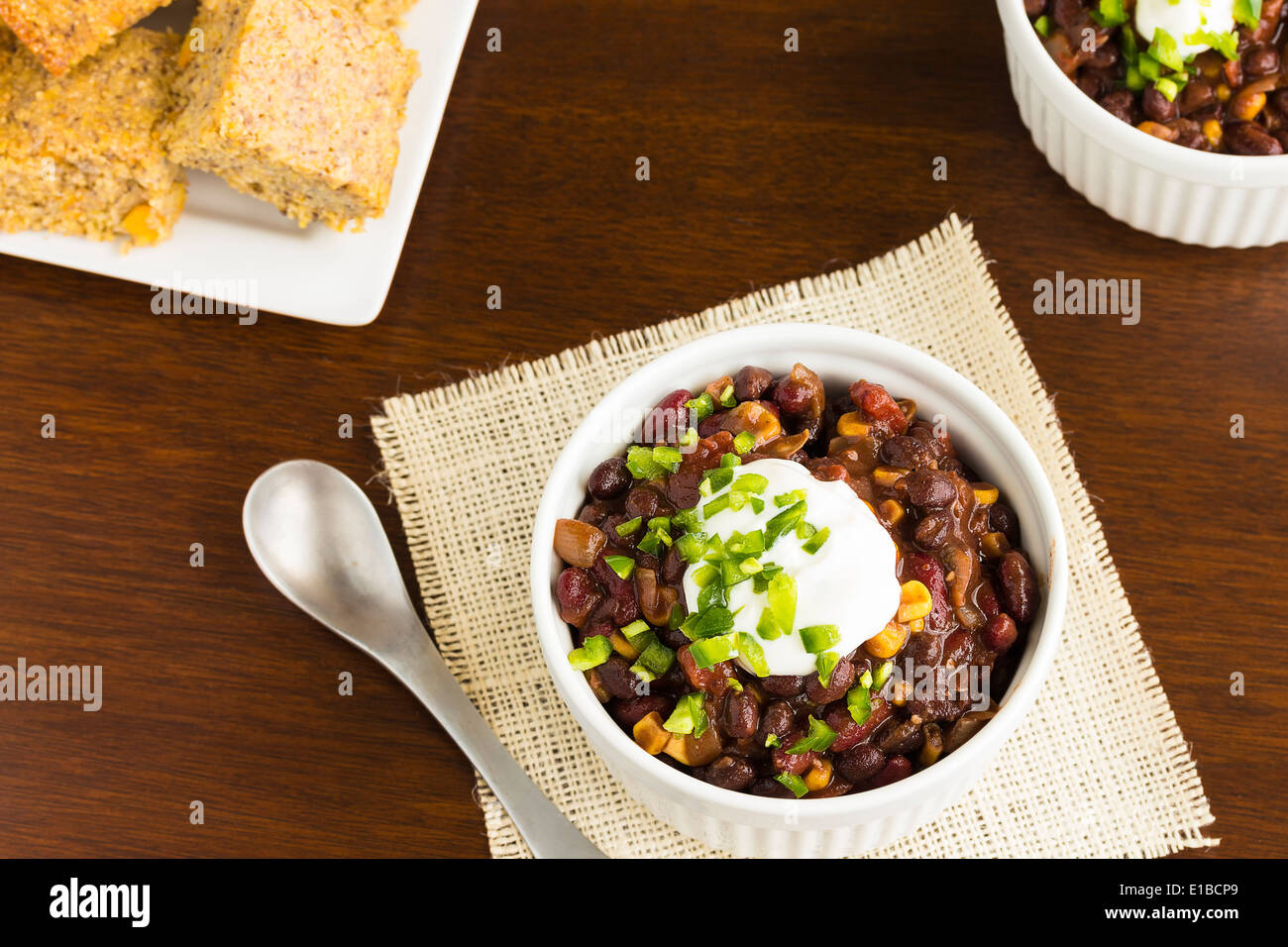 Vegetarian chili with onions, tomatoes, corn, kidney and black beans