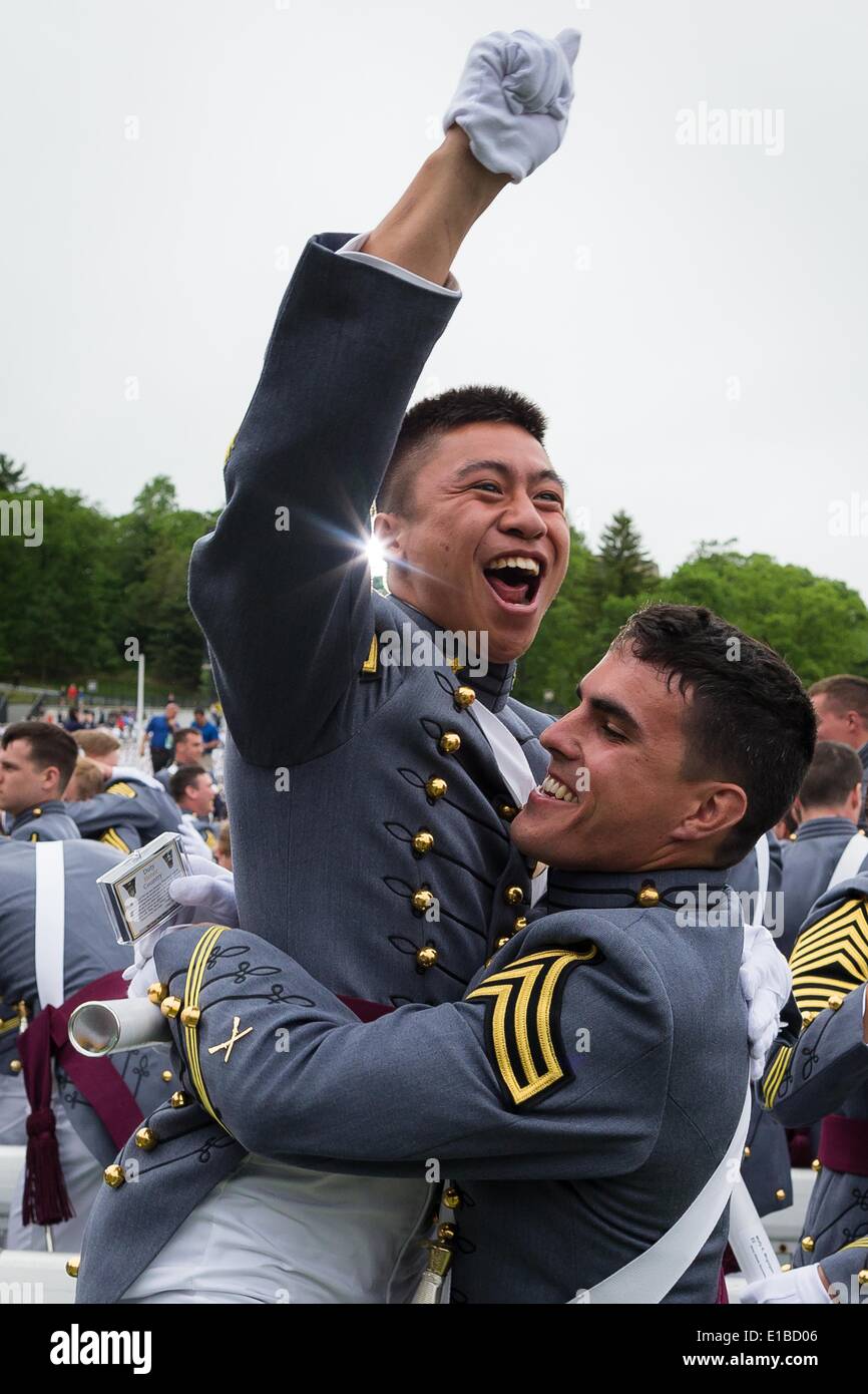 Cadets at the U.S. Military Academy in full parade dress  celebrate the completion of the graduation ceremonies May 28, 2014 in West Point, New York. More than 1,000 cadets of Class of 2014 received their diplomas in Michie Stadium and were Commissioned second lieutenants in the U.S. Army. Stock Photo