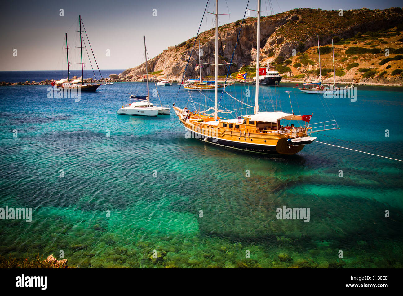 Bay and sailing ships near Knidos ancient Greek city ruins. Datca peninsula, Mugla province, Turkey. Stock Photo
